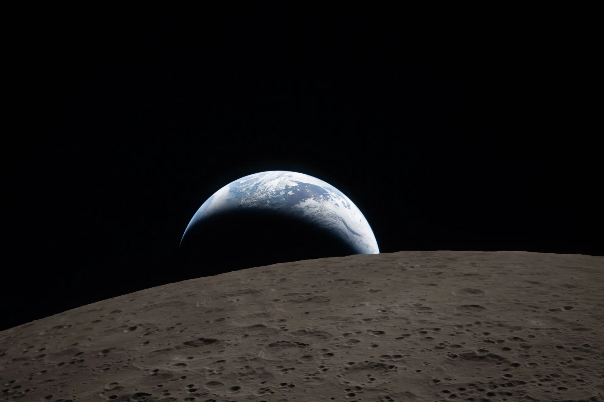 Earth sets behind the Moon, photographed by the Artemis II crew in April 2026.