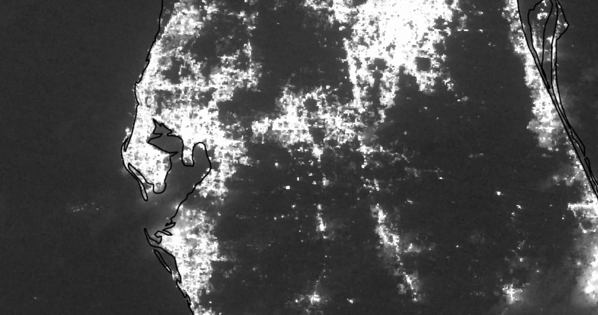 The same area on October 13, 2024: much of St. Petersburg, Sarasota and the coast south of Tampa Bay is dark.